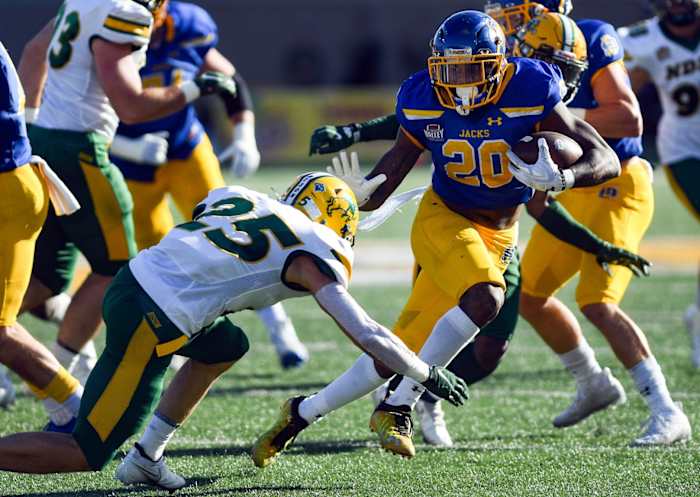 South Dakota State's Pierre Strong, Jr. avoids a tackle by North Dakota State's Michael Tutsie. Erin Woodiel / Argus Leader / USA TODAY NETWORK